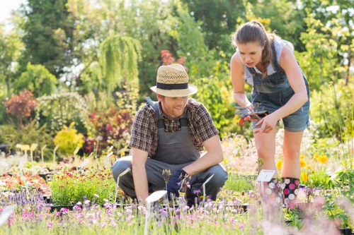 Company logo with garden tools representing Gardening Services Mayfair policy