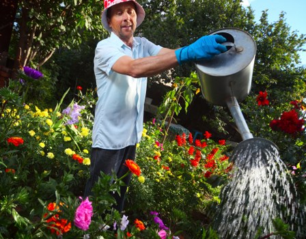 Professional gardener assessing soil quality in a Mayfair garden